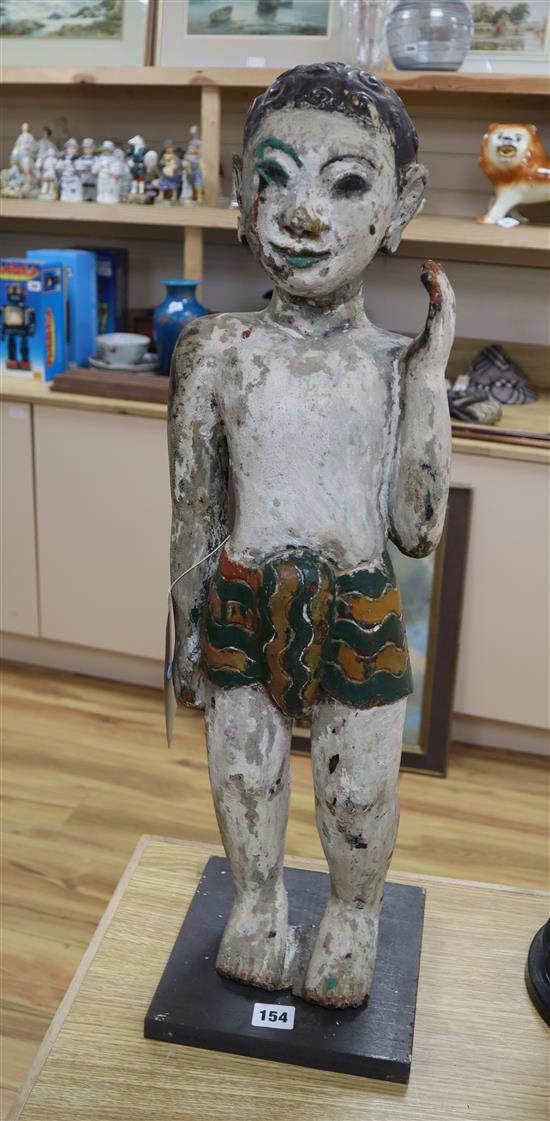 An Indian carved painted wooden figure height 68cm